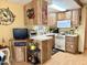 Efficient kitchen layout with white appliances and ample cabinetry for storage and functionality at 7750 E Broadway Rd # 123, Mesa, AZ 85208