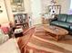 A cozy living room featuring a large rug, comfortable seating and decor at 7750 E Broadway Rd # 123, Mesa, AZ 85208