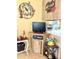 A cozy corner in living room with TV, decorations and small breakfast nook at 7750 E Broadway Rd # 123, Mesa, AZ 85208