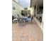 Charming outdoor patio area with a dining set, seating, and convenient access to the carport at 7750 E Broadway Rd # 123, Mesa, AZ 85208