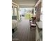 Inviting covered porch featuring outdoor seating, stylish decor, and a view of the neighborhood at 7750 E Broadway Rd # 123, Mesa, AZ 85208
