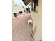 Practical side yard featuring gravel ground, a small table, and space between homes at 7750 E Broadway Rd # 123, Mesa, AZ 85208
