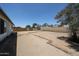 Expansive dirt backyard featuring desert landscaping and perimeter privacy fencing, perfect for customization at 812 E Piute Ave, Phoenix, AZ 85024