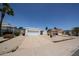 Single-story home featuring a two-car garage and low-maintenance desert landscaping at 812 E Piute Ave, Phoenix, AZ 85024