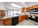 Bright kitchen next to living room features laminate countertops and essential appliances at 812 E Piute Ave, Phoenix, AZ 85024