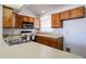 Functional kitchen features laminate countertops and cabinetry, and essential appliances at 812 E Piute Ave, Phoenix, AZ 85024