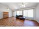 Bright living room with vaulted ceiling, wood floors, and large windows at 812 E Piute Ave, Phoenix, AZ 85024