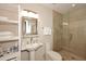 Bathroom featuring a glass enclosed shower and pedestal sink at 8230 E Via Del Sol Dr, Scottsdale, AZ 85255