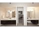 A spacious primary bath boasts double vanities, large mirrors, and walk-in closet access at 8230 E Via Del Sol Dr, Scottsdale, AZ 85255