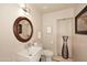 Well-lit bathroom featuring a decorative mirror and sleek fixtures at 8230 E Via Del Sol Dr, Scottsdale, AZ 85255