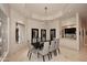 The dining room is bathed in natural light and boasts an elegant chandelier at 8230 E Via Del Sol Dr, Scottsdale, AZ 85255