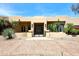 Southwest home exterior with desert landscaping and a secure gated entrance at 8230 E Via Del Sol Dr, Scottsdale, AZ 85255