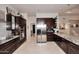 Gourmet kitchen with stainless steel appliances, granite counters, and ample cabinet space at 8230 E Via Del Sol Dr, Scottsdale, AZ 85255