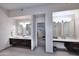 Elegant main bathroom with double vanity, spacious layout, and tile flooring at 8230 E Via Del Sol Dr, Scottsdale, AZ 85255
