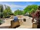 Outdoor kitchen and BBQ area with sink, grill, and countertop space at 8230 E Via Del Sol Dr, Scottsdale, AZ 85255