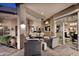 Inviting covered patio with ample seating and access to the backyard at 8230 E Via Del Sol Dr, Scottsdale, AZ 85255