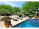 Gorgeous backyard pool with stone deck and resort-style landscaping at 8230 E Via Del Sol Dr, Scottsdale, AZ 85255