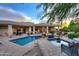 Backyard pool and outdoor living area featuring an in-ground pool, spa, and lounge chairs at 8230 E Via Del Sol Dr, Scottsdale, AZ 85255