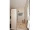Walk-in shower with pebble floor, glass block window, and wooden bench at 8230 E Via Del Sol Dr, Scottsdale, AZ 85255