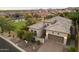 Aerial view of home featuring a three-car garage and desert landscaping at 8234 E Inca St, Mesa, AZ 85207