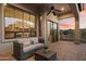 Covered patio with outdoor seating and sunset views; great for relaxing and entertaining at 8234 E Inca St, Mesa, AZ 85207