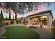 Beautiful backyard with covered patio, artificial turf and professional landscaping at 8234 E Inca St, Mesa, AZ 85207