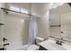 Cozy bathroom featuring a single sink vanity and shower-tub combo with a privacy curtain at 8234 E Inca St, Mesa, AZ 85207