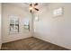 Neutral bedroom with carpet, a ceiling fan, and multiple windows with shutters at 8234 E Inca St, Mesa, AZ 85207