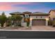 Charming home featuring a desert landscape, three-car garage and tile roof at 8234 E Inca St, Mesa, AZ 85207