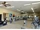 Well-lit fitness center with modern equipment and inspiring artwork, perfect for community workouts at 8234 E Inca St, Mesa, AZ 85207