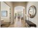 Inviting foyer with tile floors, arched doorways, and modern decor at 8234 E Inca St, Mesa, AZ 85207