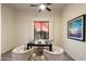 Cozy home office with neutral walls, a black desk, and window with a picturesque view at 8234 E Inca St, Mesa, AZ 85207