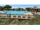 Community pool area featuring a lap pool, spa, gazebo, and various seating at 8234 E Inca St, Mesa, AZ 85207