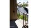 Apartment entrance featuring a staircase with metal railing, view of the parking and landscaping with plants and flowers at 8787 E Mountain View Rd # 2008, Scottsdale, AZ 85258