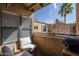Relaxing balcony with comfortable seating and views of palm trees and neighboring buildings at 8787 E Mountain View Rd # 2008, Scottsdale, AZ 85258