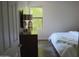 Bright bedroom with natural light, dresser, TV, and cozy bed at 8787 E Mountain View Rd # 2008, Scottsdale, AZ 85258