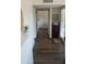 Bright hallway featuring hardwood floors and fresh white paint at 8787 E Mountain View Rd # 2008, Scottsdale, AZ 85258