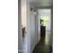 Hallway leading into the bedroom features wood flooring and stylish lighting at 8787 E Mountain View Rd # 2008, Scottsdale, AZ 85258