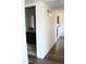 Hallway leads to bathroom and kitchen with modern lighting fixtures at 8787 E Mountain View Rd # 2008, Scottsdale, AZ 85258