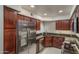 Modern kitchen with stainless steel appliances, granite countertops, and ample cabinet space at 8787 E Mountain View Rd # 2008, Scottsdale, AZ 85258