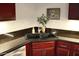Kitchen sink features dark countertops, bright backsplash, and updated fixtures, perfect for efficient meal preparation at 8787 E Mountain View Rd # 2008, Scottsdale, AZ 85258