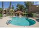 Sparkling pool and hot tub surrounded by comfortable lounge chairs and a covered gazebo at 8787 E Mountain View Rd # 2008, Scottsdale, AZ 85258