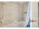 Clean bathroom with white tile and modern fixtures, featuring a relaxing soaking tub and elegant shower head at 8907 N 85Th Way, Scottsdale, AZ 85258