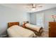 Cozy bedroom featuring two twin beds, carpeted floors, and a ceiling fan at 8907 N 85Th Way, Scottsdale, AZ 85258