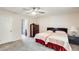 Bedroom featuring two twin beds, carpeted floors, and an attached bathroom with shower at 8907 N 85Th Way, Scottsdale, AZ 85258