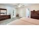 Spacious bedroom featuring two twin beds, carpeted floors, and an attached bathroom at 8907 N 85Th Way, Scottsdale, AZ 85258