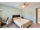 Calm bedroom features a ceiling fan, and a neutral palette creating a serene atmosphere for rest and relaxation at 8907 N 85Th Way, Scottsdale, AZ 85258