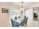 Dining room with a glass table set and a window providing natural light at 8907 N 85Th Way, Scottsdale, AZ 85258