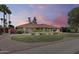 Charming single-story home with a manicured lawn, gravel landscaping, and vibrant bougainvillea at 8907 N 85Th Way, Scottsdale, AZ 85258