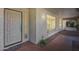 Front entry featuring a decorative front door, sidelight window, and tiled porch at 8907 N 85Th Way, Scottsdale, AZ 85258